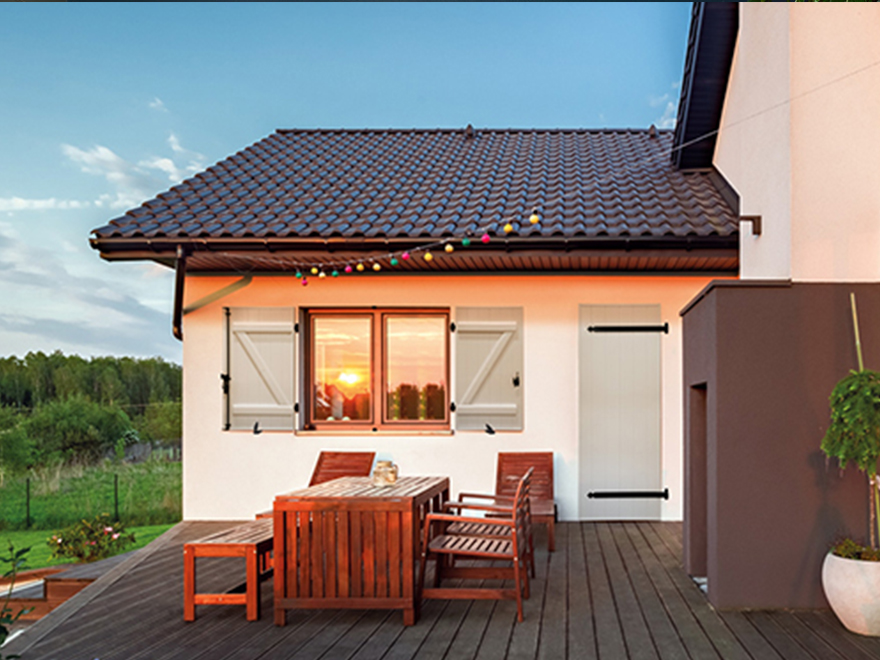 Window and Shutter of Historic with green front door at twilight